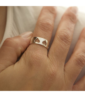 Hand with silver heart ring