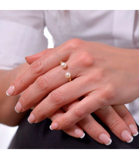 Woman with pearl ring in golden silver