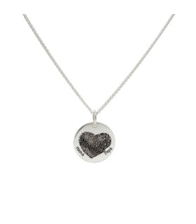 Silver necklace with a heart-shaped footprint.